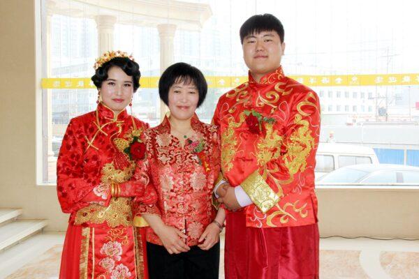Shumei Kang with her son and daughter-in-law on their wedding day. (Courtesy of Shuzhi Kang)