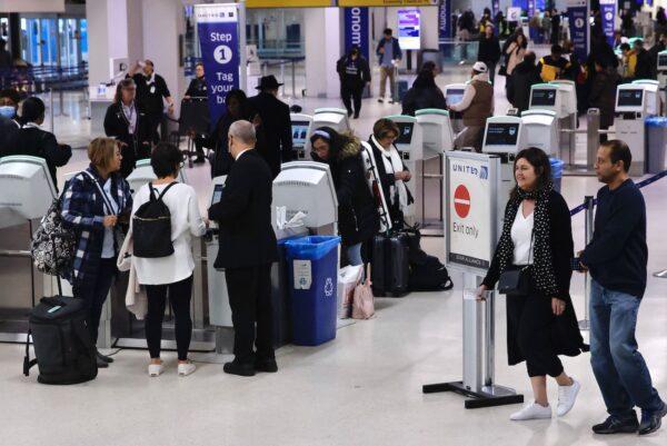 Passengers check in for flights at Newark International Airport, New Jersey, on Jan. 11, 2023. (Kena Betancur/AFP via Getty Images)