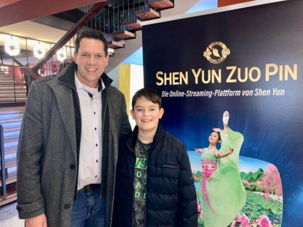 Torsten Mierdorf and his son Fabio at Shen Yun in Frankfurt on Jan. 11, 2023. (Nancy McDonnell/The Epoch Times)