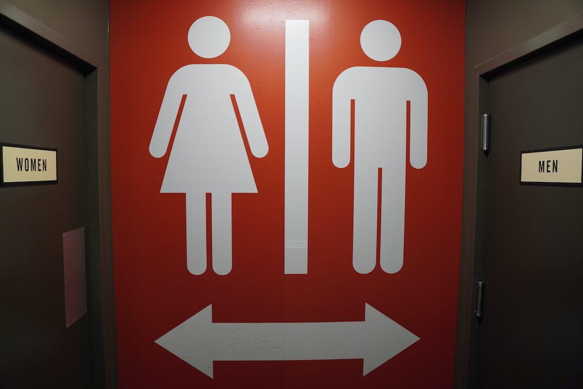 A sign outside restrooms in Chattanooga, Tenn., on Jan. 13, 2023, seems to indicate that women and men should use separate facilities. (Jackson Elliott/The Epoch Times)