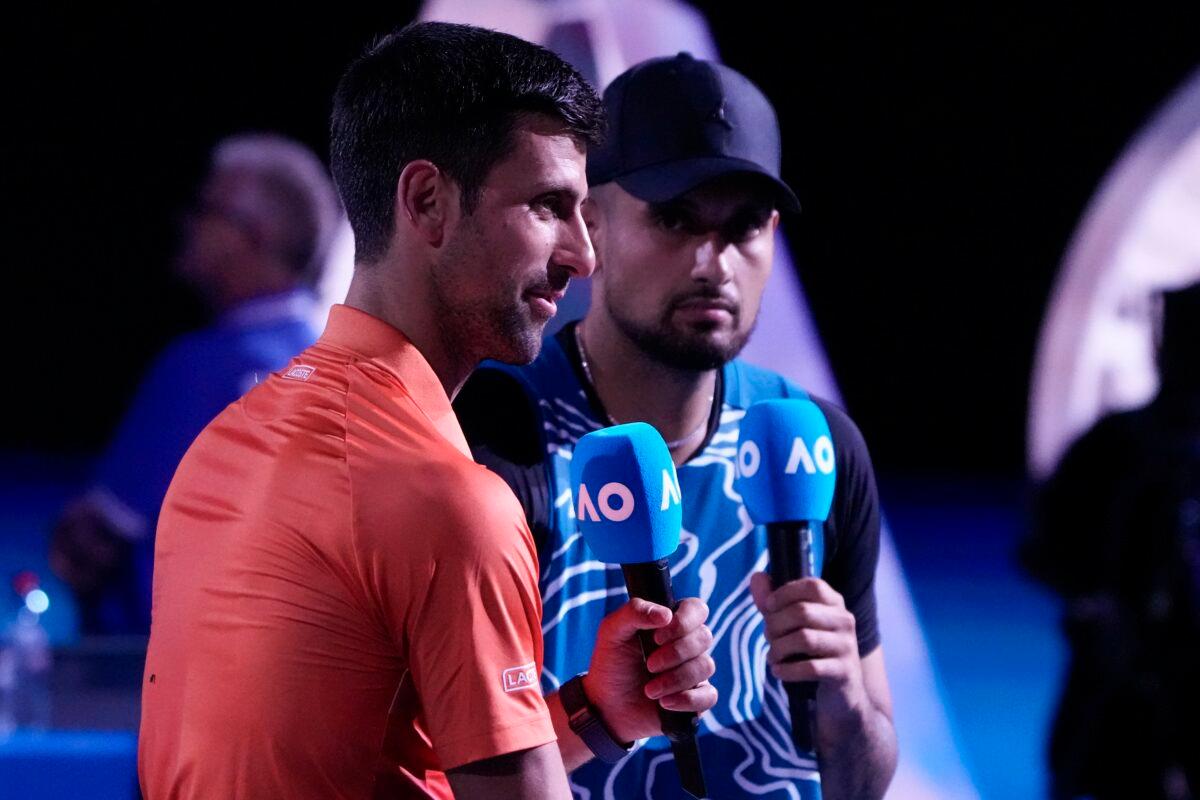 Serbia's Novak Djokovic (L) and Australia's Nick Kyrgios are interviewed following an exhibition match on Rod Laver Arena ahead of the Australian Open tennis championship in Melbourne, Australia, on Jan. 13, 2023. (Mark Baker/AP Photo)