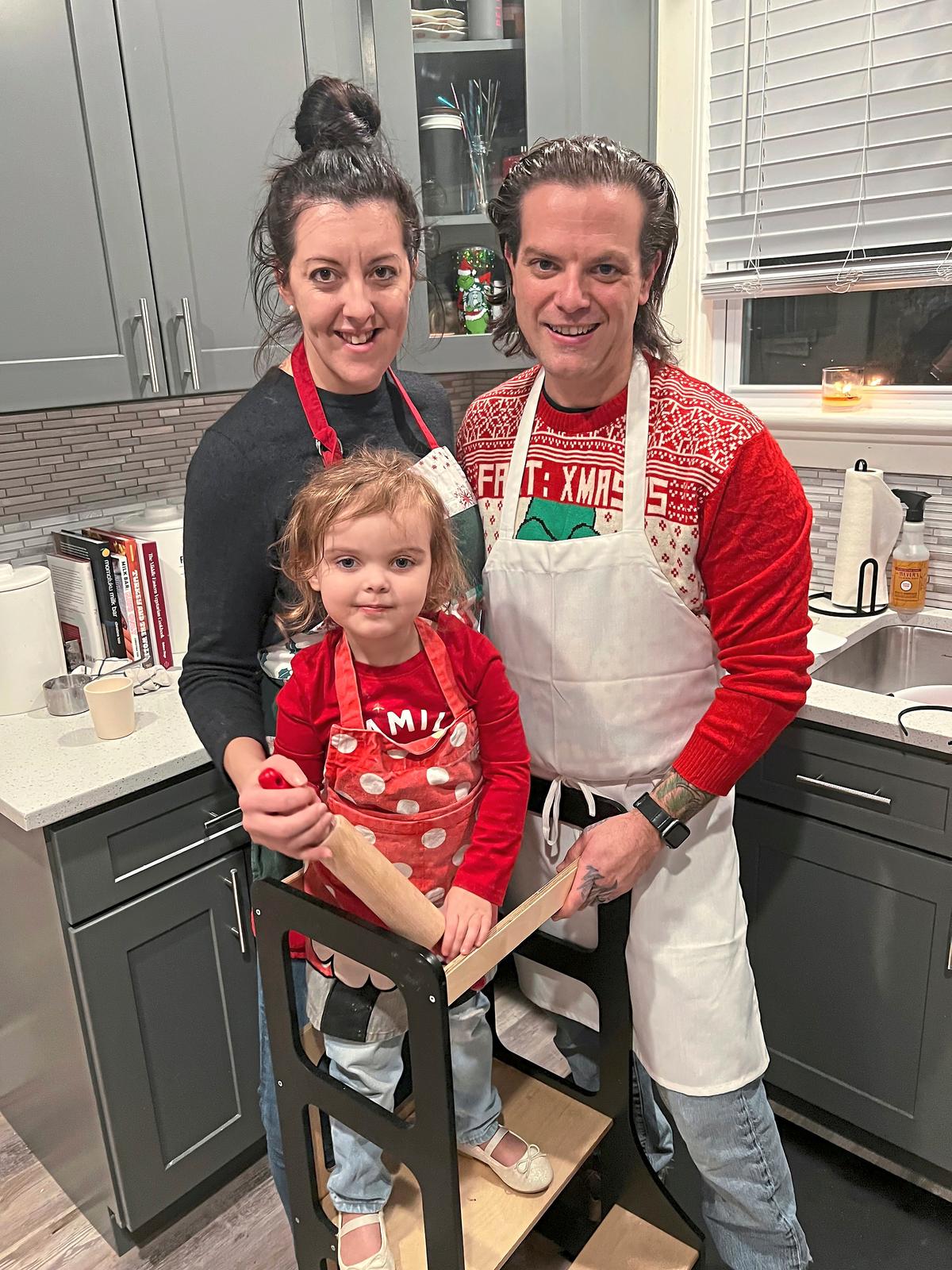 Lindsay and Dustin Gardner with their 3-year-old daughter, Ellie, in their White Oak kitchen. (Gretchen McKay/Pittsburgh Post-Gazette/TNS)