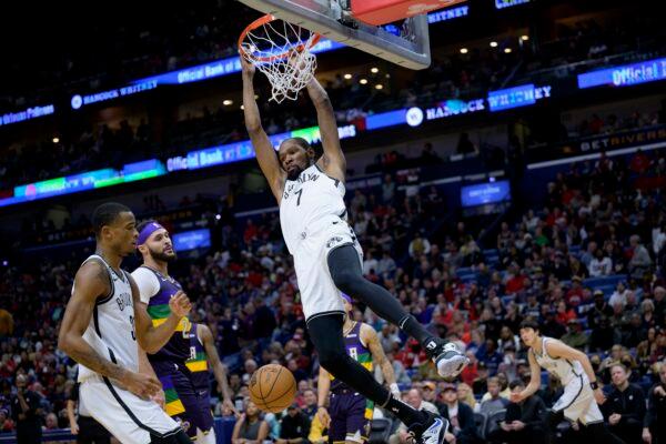 Brooklyn Nets forward Kevin Durant (7) dunks in the first half of an NBA basketball game against the New Orleans Pelicans in New Orleans on Jan. 6, 2023. (Matthew Hinton/AP Photo)