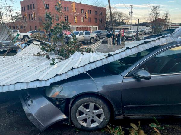 A damaged vehicle and debris are seen in the aftermath of severe weather, in Selma, Ala., on Jan. 12, 2023. (Butch Dill/ AP Photo)
