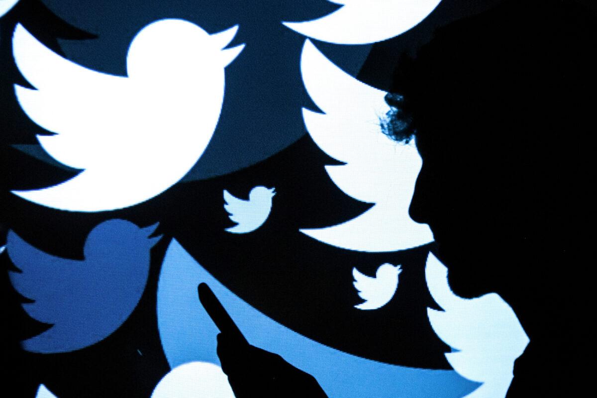Photo illustration featuring the Twitter logo. (Leon Neal/Getty Images)