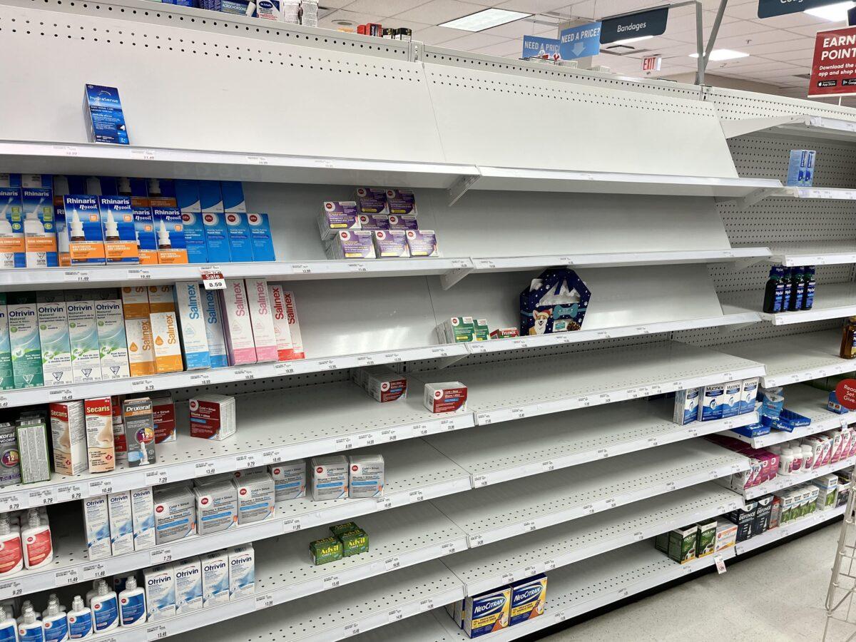 Empty shelves in a Shoppers Drug Mart store in the GTA due to supply shortages of cold, cough, and flu medication and increased demand due to seasonal illnesses. (Roger Li and Lily Guo/NTD)