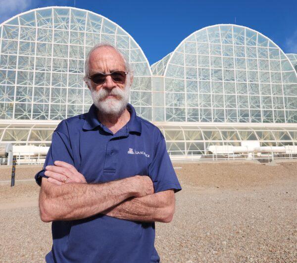 Biosphere 2 Director Dr. Joaquin Ruiz, also vice president for global environmental futures, and dean emeritus of the College of Science at the University of Arizona, stands in front of the ecological research facility on Jan. 11, 2023. (Allan Stein/The Epoch Times)