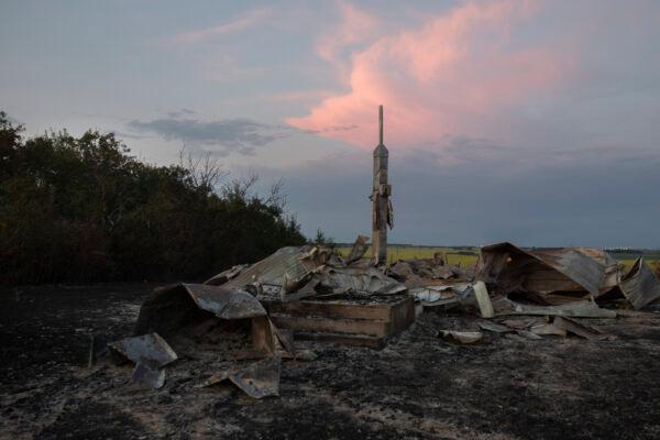 Ashes and debris is all that remains after a fire at the former Holy Trinity Roman Catholic Church near Orolow, Sask., Thursday, July 8, 2021. (The Canadian Press/Kayle Neis)