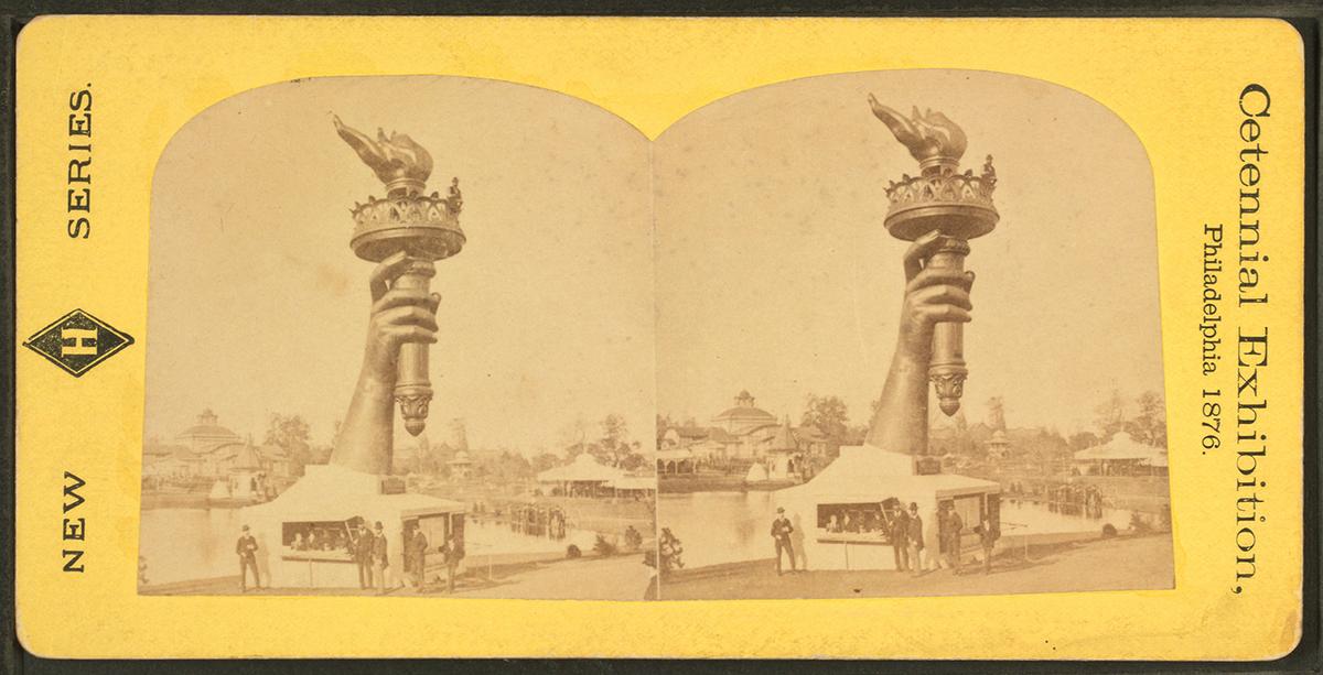 The colossal hand and torch of Bartholdi's Statue of Liberty at the Centennial Exhibition in Philadelphia, 1876. New York Public Library. (Public Domain)