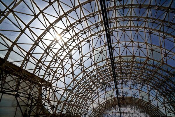 The glass roof and metal cross-beam superstructure of Biosphere 2's Landscape Evolution Observatory in Oracle, Ariz., on Jan. 11, 2023. (Allan Stein/The Epoch Times)