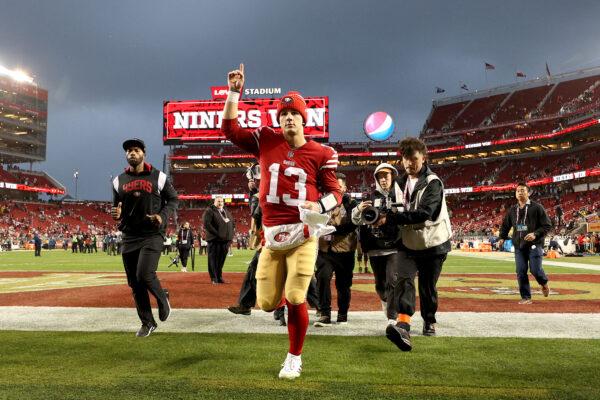 Brock Purdy (13) of the San Francisco 49ers celebrates as he runs off the field after defeating the Seattle Seahawks in the NFC Wild Card playoff game at Levi's Stadium in Santa Clara, Calif., on Jan. 14, 2023. (Ezra Shaw/Getty Images)