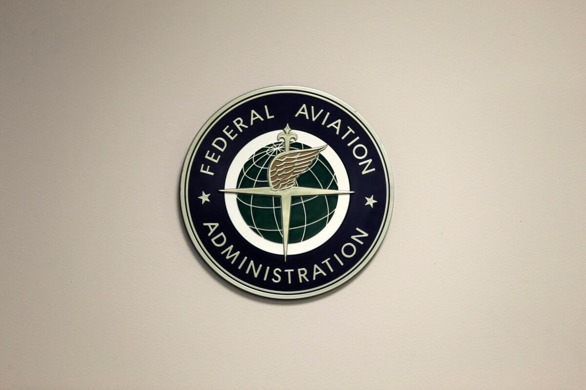 A Federal Aviation Administration sign hangs in the tower at John F. Kennedy International Airport in New York on March 16, 2017. (Seth Wenig/AP Photo)