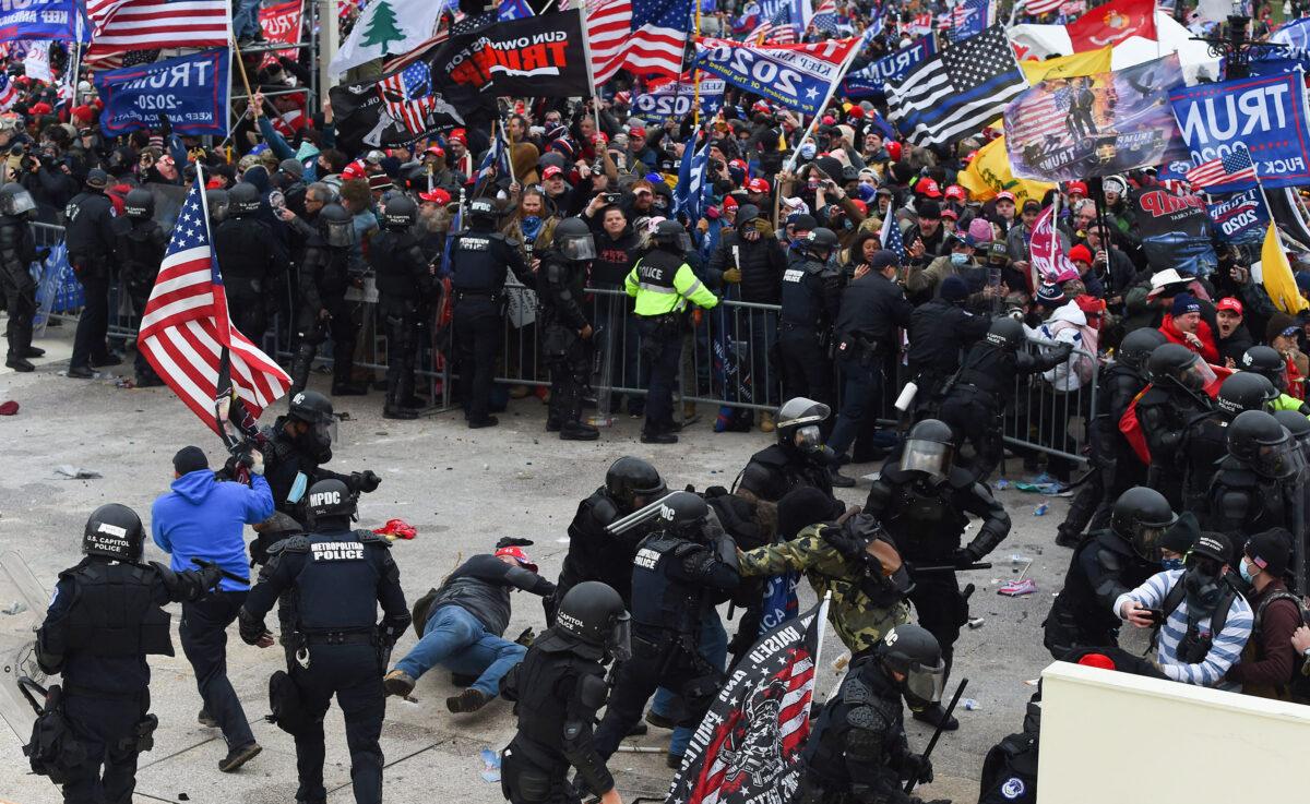 Trump supporters clash with police and security forces at the U.S. Capitol in Washington on Jan. 6, 2021. (Roberto Schmidt/AFP via Getty Images)