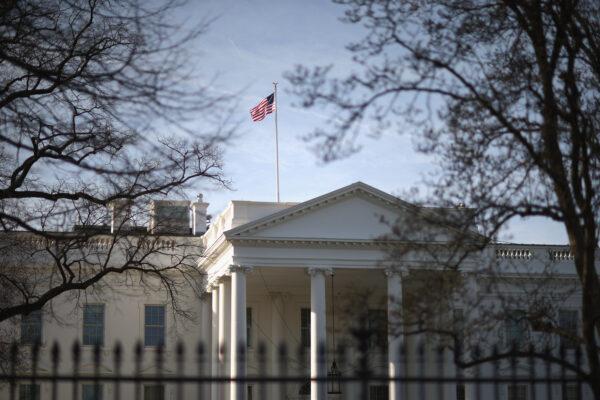Morning sunlight strikes the flag flying above the White House in Washington, on March 18, 2015. (Chip Somodevilla/Getty Images)