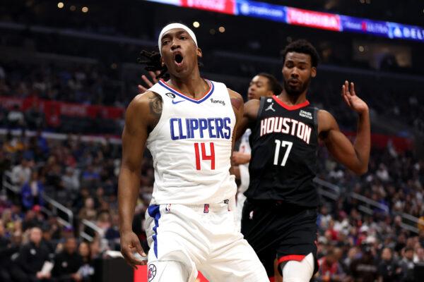 Terance Mann (14) of the LA Clippers reacts to scoring s Tari Eason (17) of the Houston Rockets looks on during the first half of a game in Los Angeles on January 15, 2023. (Sean M. Haffey/Getty Images)