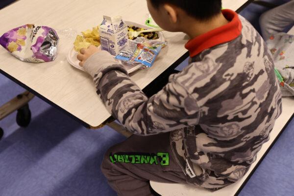 A student eats lunch at Yung Wing School P.S. 124 in New York City on Feb. 4, 2022. (Michael Loccisano/Getty Images)