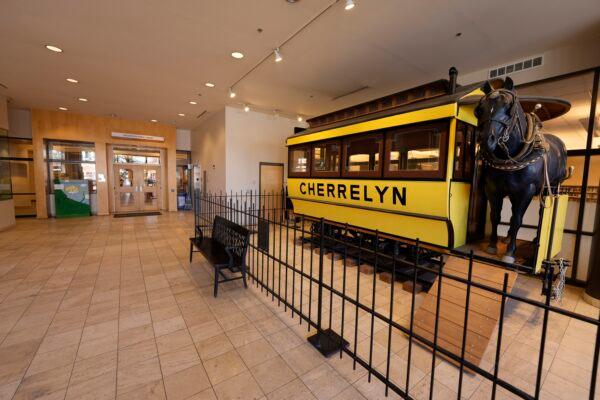 A restored Cherrelyn horsecar that used to run between Denver and Englewood, Colo., stands in the lobby of city hall outside the main doors to the library in the south Denver suburb of Englewood, Colo., on Jan. 12, 2022. (David Zalubowski/AP Photo)