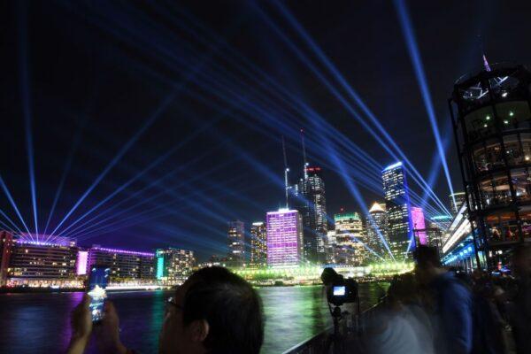 Visitors gather to see light installations at Sydney Harbour at the start of the Vivid Sydney festival in Sydney on May 24, 2019. Vivid Sydney is an outdoor cultural festival featuring light installations and projections. (Saeed Khan/AFP via Getty Images)