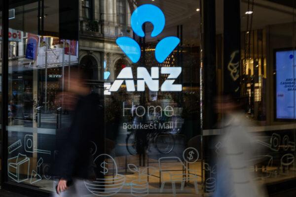People are seen walking past an ANZ Home loan branch in Melbourne, Australia, on May 3, 2022. (Asanka Ratnayake/Getty Images)