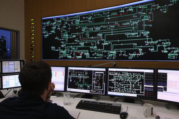 A technician monitors electricity levels in front of a giant screen showing the eastern German electricity transmission grid in the control centre at Neuenhagen bei Berlin, Germany, on Dec. 17, 2015. (Sean Gallup/Getty Images)