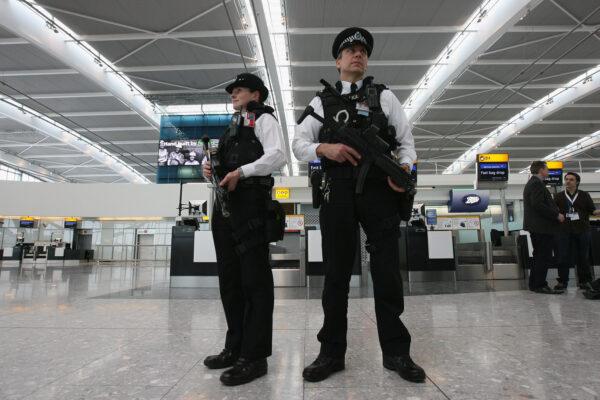 Armed police officers patrol the new Terminal 5 at Heathrow Airport prior to its official opening, in London, on March 14, 2008. (Dan Kitwood /Getty Images)