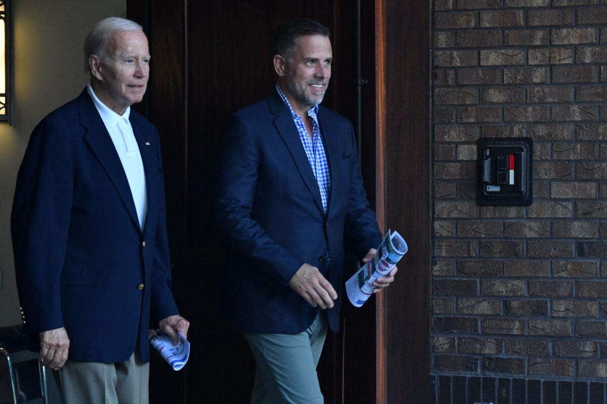 President Joe Biden (L) and his son Hunter Biden exit Holy Spirit Catholic Church after attending mass in Johns Island, S.C., on Aug. 13, 2022. (Nicholas Kamm/AFP via Getty Images)