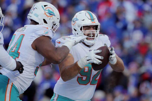Miami Dolphins defensive tackle Zach Sieler (92) celebrates after his touchdown during the second half of an NFL wild-card playoff football game against the Buffalo Bills in Orchard Park, N.Y., on Jan. 15, 2023. (Joshua Bessex/AP Photo)