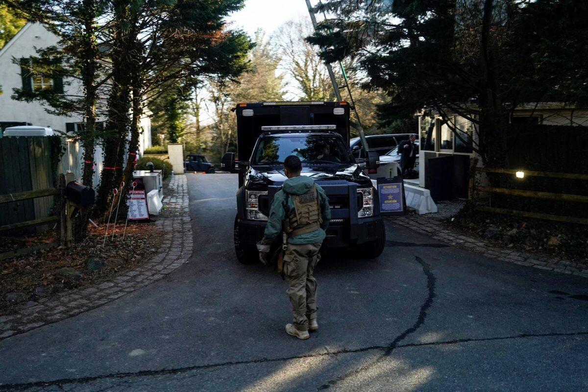 Secret Service personnel park vehicles in the driveway leading to President Joe Biden's house after classified documents were found there by Biden's lawyers, in Wilmington, Del., on Jan. 15, 2023. (Joshua Roberts/Reuters)