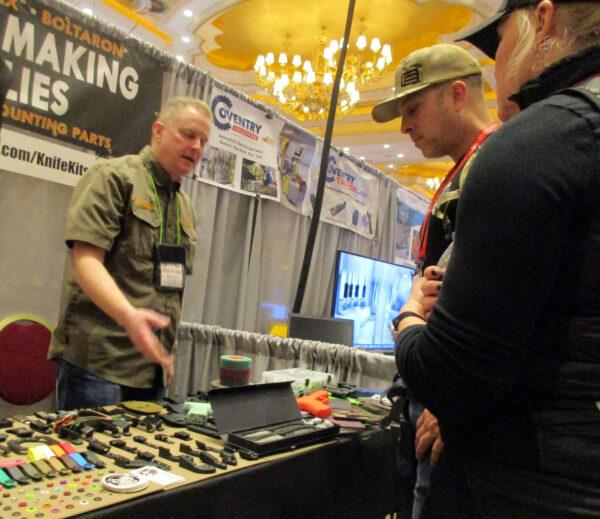 (Left) Steve Andrews (CKK Industries Inc.) and Christopher Edwards discuss the items CKK Industries can provide for holster and knife makers during the Supplier Showcase at the National Shooting Sports Foundations SHOT Show on Jan. 16, 2023. (Michael Clements)