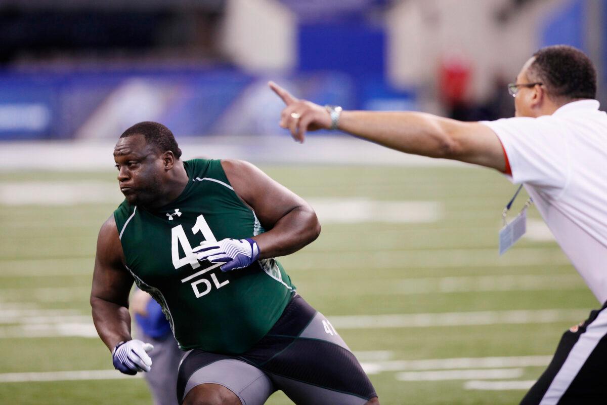 Defensive lineman Jerrell Powe of Mississippi runs through a drill during the 2011 NFL Scouting Combine at Lucas Oil Stadium in Indianapolis, Indiana, on Feb. 28, 2011. (Joe Robbins/Getty Images)