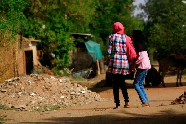 Sudanese women walk in the capital Khartoum's district of Jureif Ghar on May 5, 2020. (Ashraf Shazly/AFP via Getty Images)