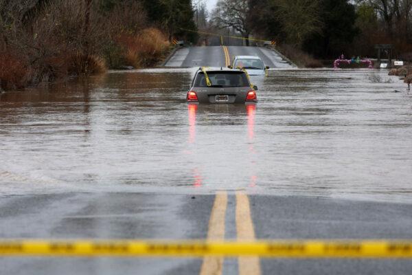 Cars are submerged in floodwater after heavy rain moved through Windsor, Calif., on Jan. 9, 2023. (Justin Sullivan/Getty Images)