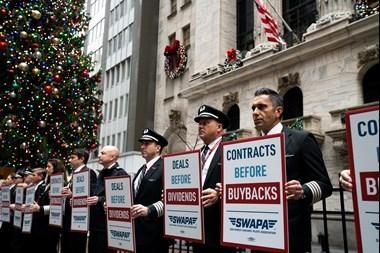 Southwest Airlines Pilots Association (SWAPA) members protest the company's prioritizing stock buybacks over labor contracts outside the New York Stock Exchange on Dec. 7, 2022. (SWAPA)