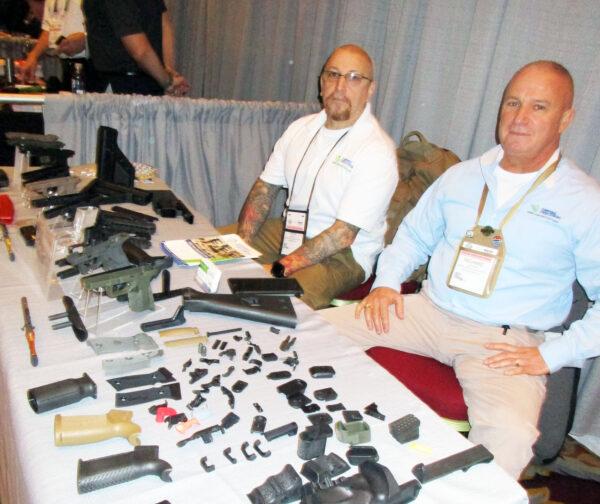 (Right) Richard Sullivan and Richard Sacheli (both of Empire Precision Plastics) display some of the injection molded plastic parts their company manufactures. (Michael Clements)