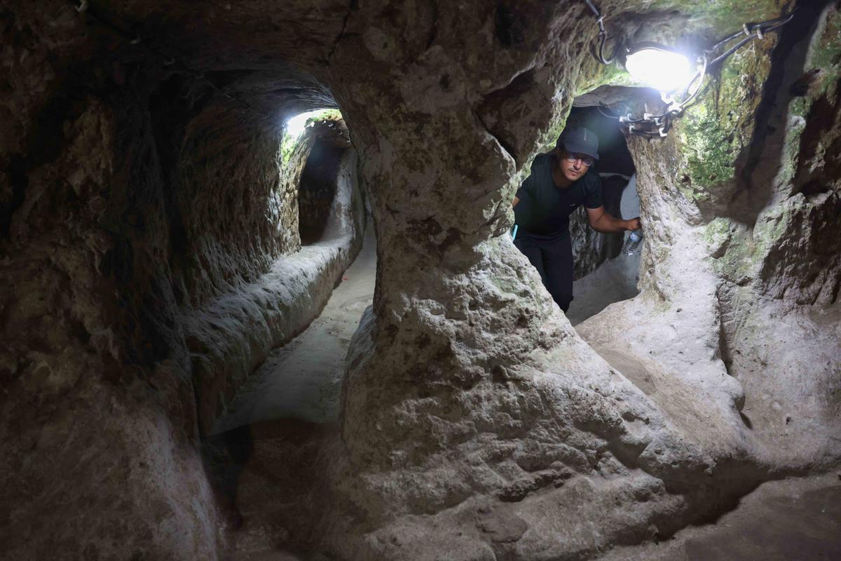 A tourist walks through a passage in the Derinkuyu underground city in Turkey. (Omar Haj Kadour/AFP via Getty Images)