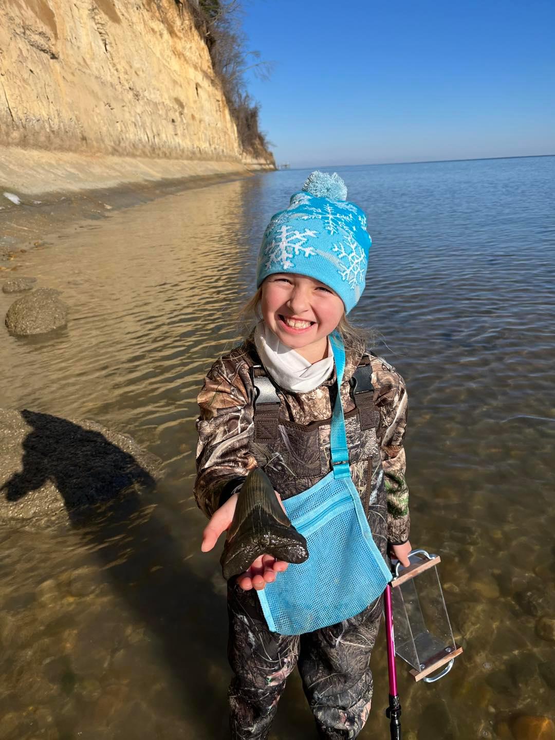 Molly upon finding her megalodon tooth. (Courtesy of <a href="https://www.instagram.com/fossilgirls_md/">@fossilgirls_md</a> and <a href="https://www.instagram.com/fossilgirls_md/">www.thefossilgirls.com</a>)