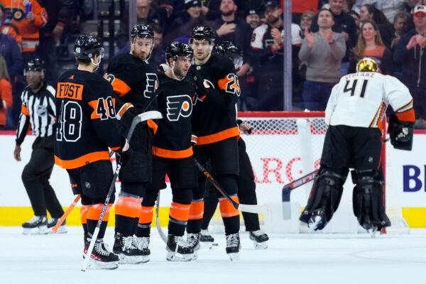 Philadelphia Flyers' Morgan Frost (48), Kevin Hayes (13), Tony DeAngelo (77) and James van Riemsdyk (25) celebrates after a goal by Hayes against Anaheim Ducks' Anthony Stolarz (41) during the first period of an NHL hockey game, in Philadelphia on Jan. 17, 2023. (Matt Slocum/AP Photo)