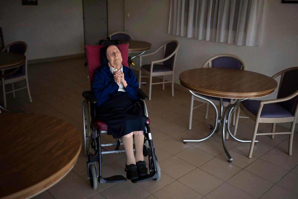 Sister Andre poses for a portrait at the Sainte Catherine Laboure care home in Toulon, southern France, on April 27, 2022. (Daniel Cole/AP Photo)