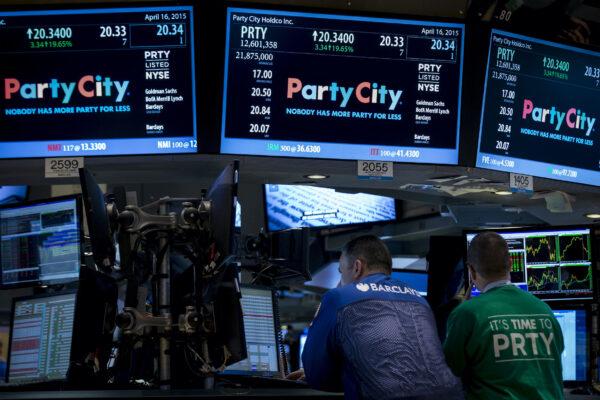 A Barclay's Capital Specialist trader works at the post that trades Party City Holdco Inc. during the company's IPO on the floor of the New York Stock Exchange on April 16, 2015. (Brendan McDermid/Reuters)