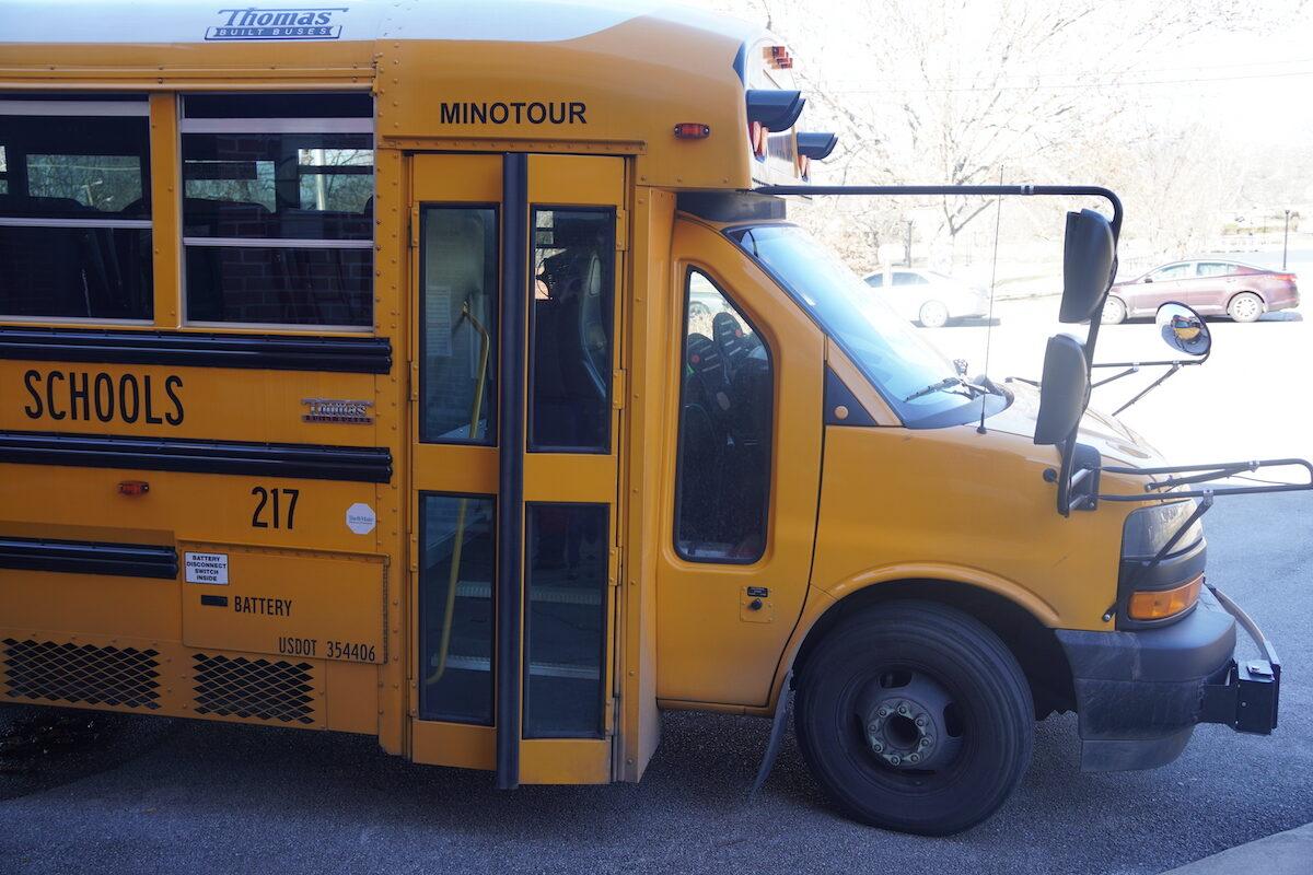 A school bus waits to pick up children outside an elementary school in Chattanooga, Tenn. on Jan. 19, 2023. (Jackson Elliott/The Epoch Times)