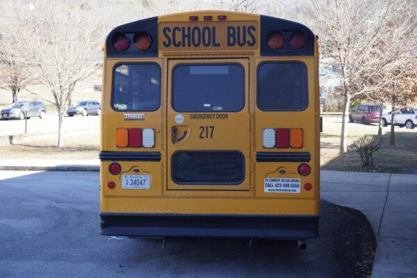A school bus waits to pick up children outside an elementary school in Chattanooga, Tenn., on Jan. 19, 2023. (Jackson Elliott/The Epoch Times)