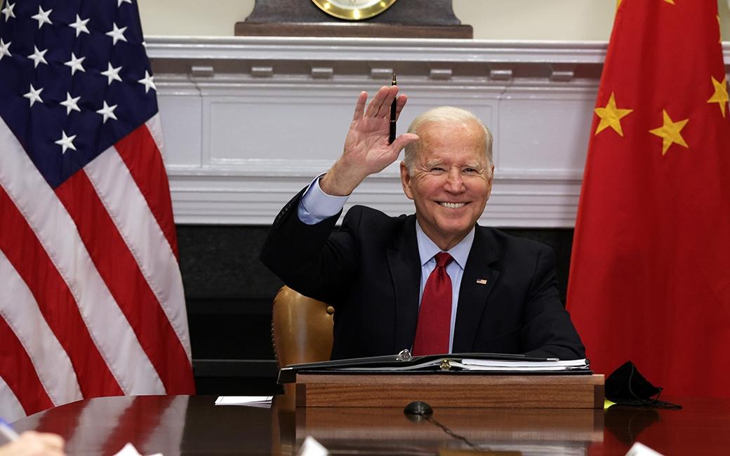 President Joe Biden waves as he participates in a virtual meeting with Chinese leader Xi Jinping at the White House on Nov. 15, 2021. (Alex Wong/Getty Images)