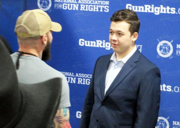 Kyle Rittenhouse (right) greets supporters during the National Shooting Sports Foundations 45th annual SHOT Show on Jan. 18, 2023. (Michael Clements/The Epoch Times)