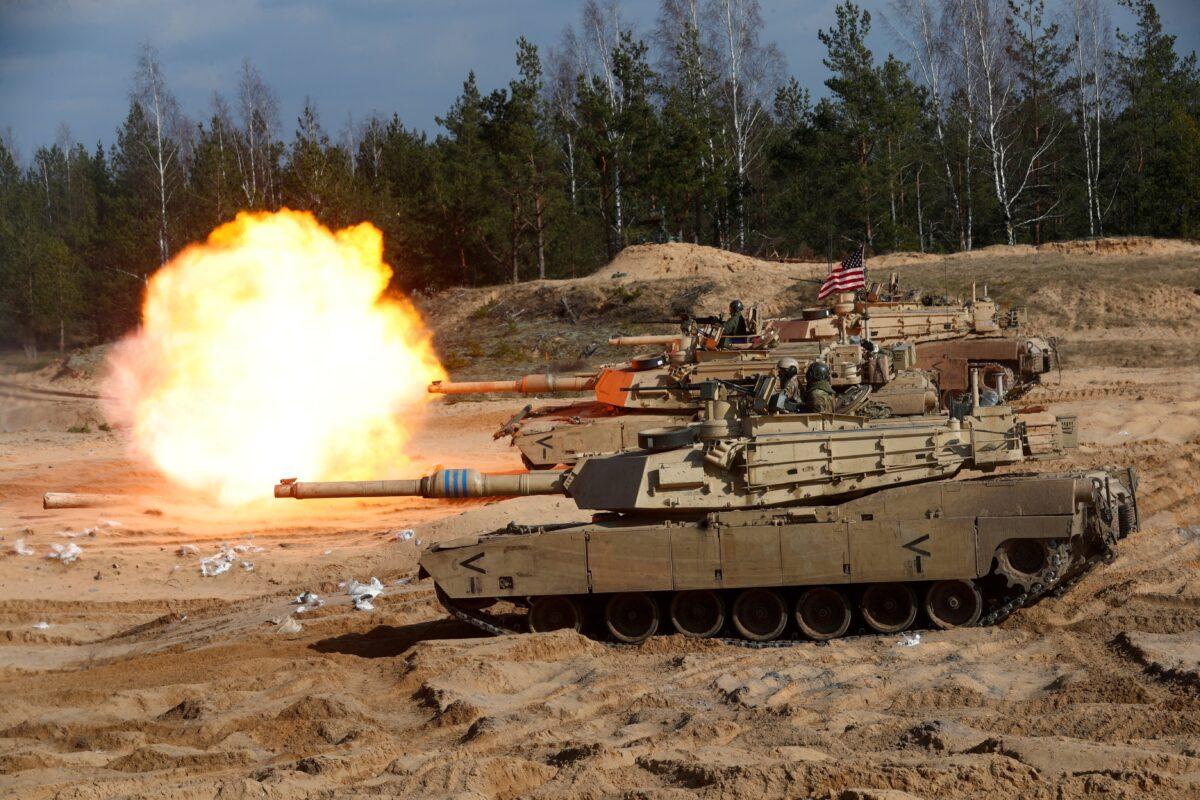 U.S. Army M1A1 Abrams tank fires during NATO enhanced Forward Presence battle group military exercise Crystal Arrow 2021 in Adazi, Latvia, on March 26, 2021. (Ints Kalnins/Reuters)