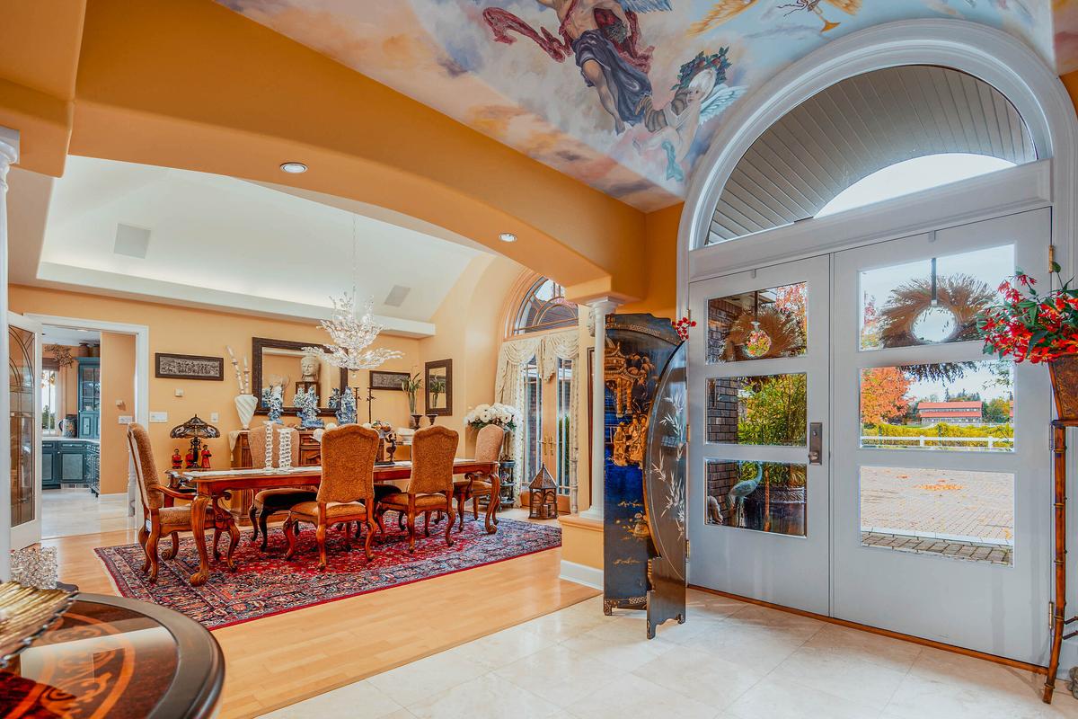 Adorned with art on its vaulted ceiling, the main foyer leads to the formal dining room and adjacent gourmet kitchen. (Courtesy of Sotheby’s International Realty Canada)