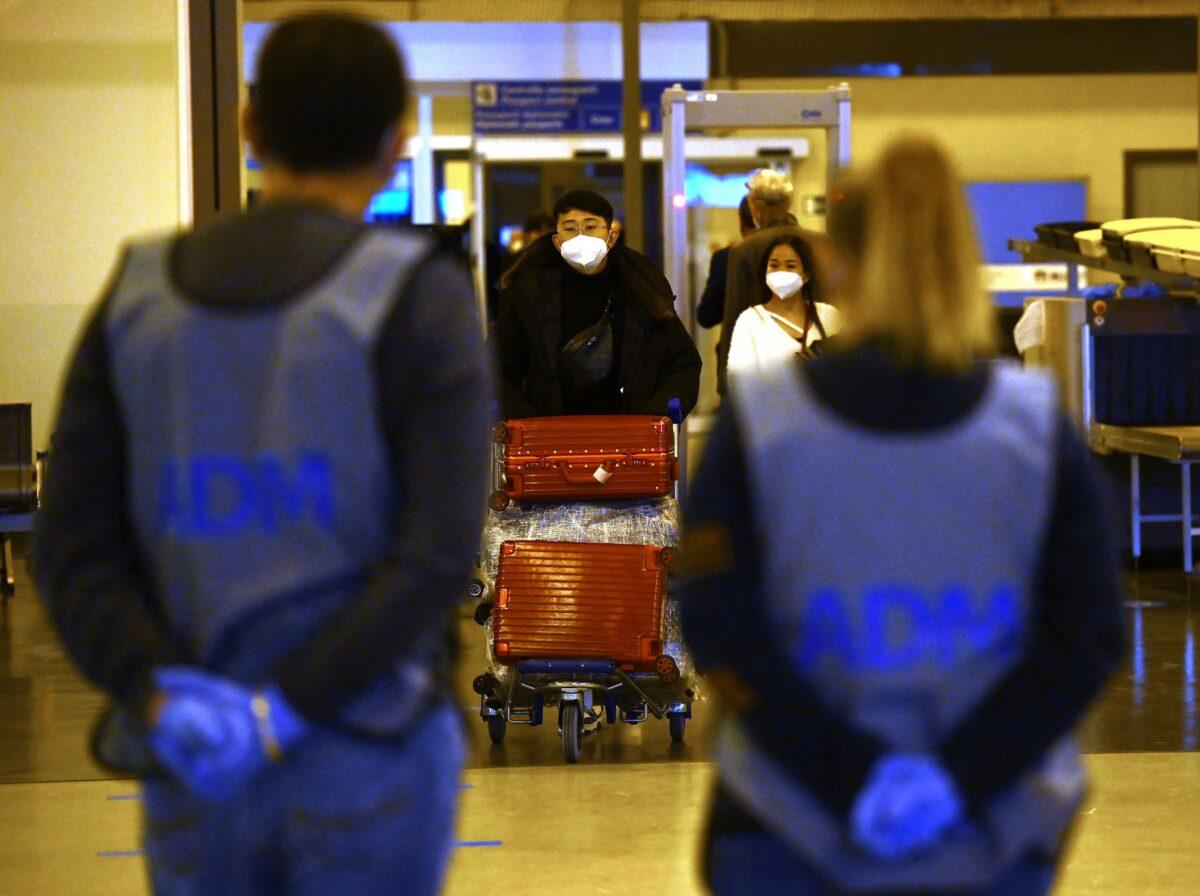 Chinese travelers leave the arrival hall of Leonardo da Vinci–Fiumicino Airport near Rome after being tested for COVID-19 on Dec. 29, 2022. (Filippo Monteforte/AFP via Getty Images)