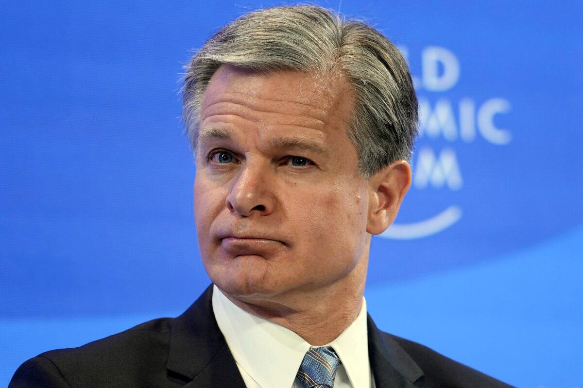 FBI Director Christopher Wray listens at the World Economic Forum in Davos, Switzerland, on Jan. 19, 2023. (AP Photo/Markus Schreiber)