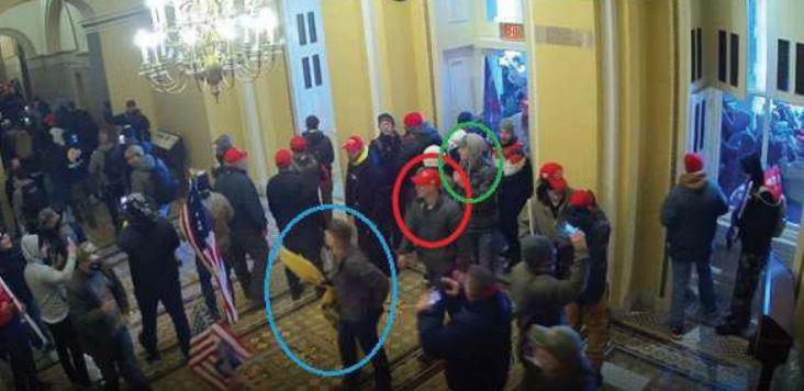 An image from surveillance video shows, according to the FBI, three Marines enter the U.S. Capitol on Jan. 6, 2021. (DOJ via The Epoch Times)
