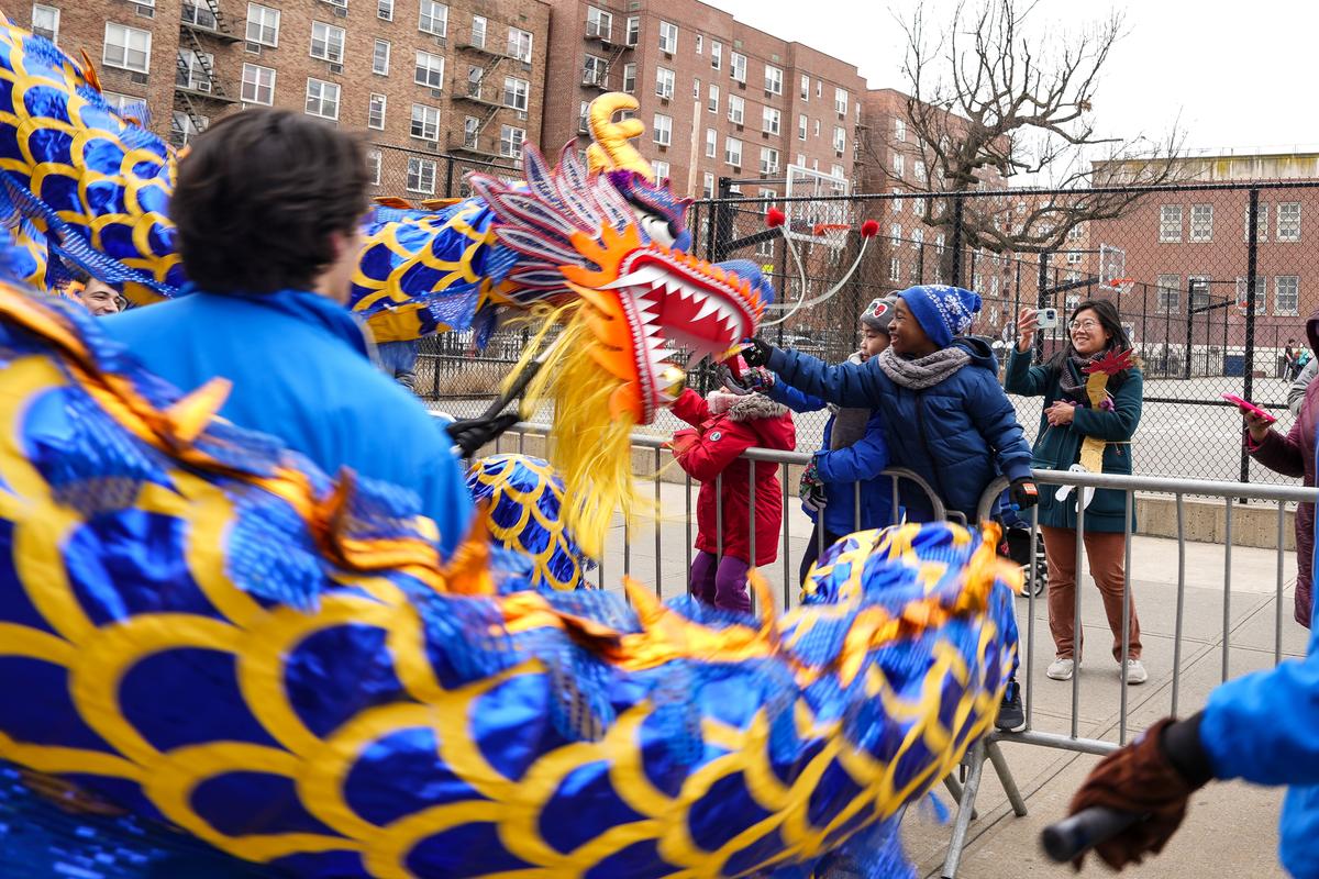 Falun Gong practitioners participate in the Chinese New Year Parade in Flushing, N.Y., on Jan. 21, 2023. (Samira Bouaou/The Epoch Times)