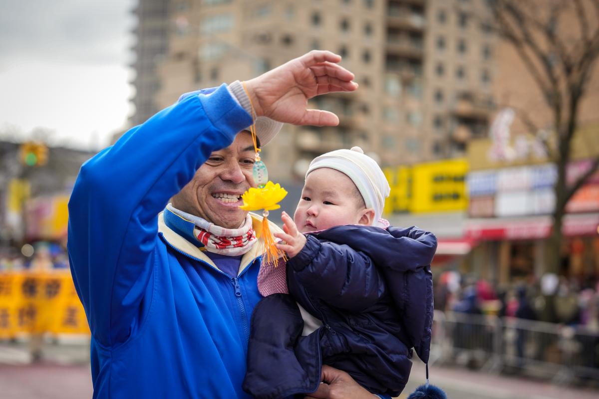 Falun Gong practitioners participate in the Chinese New Year Parade in Flushing, N.Y., on Jan. 21, 2023. (Samira Bouaou/The Epoch Times)